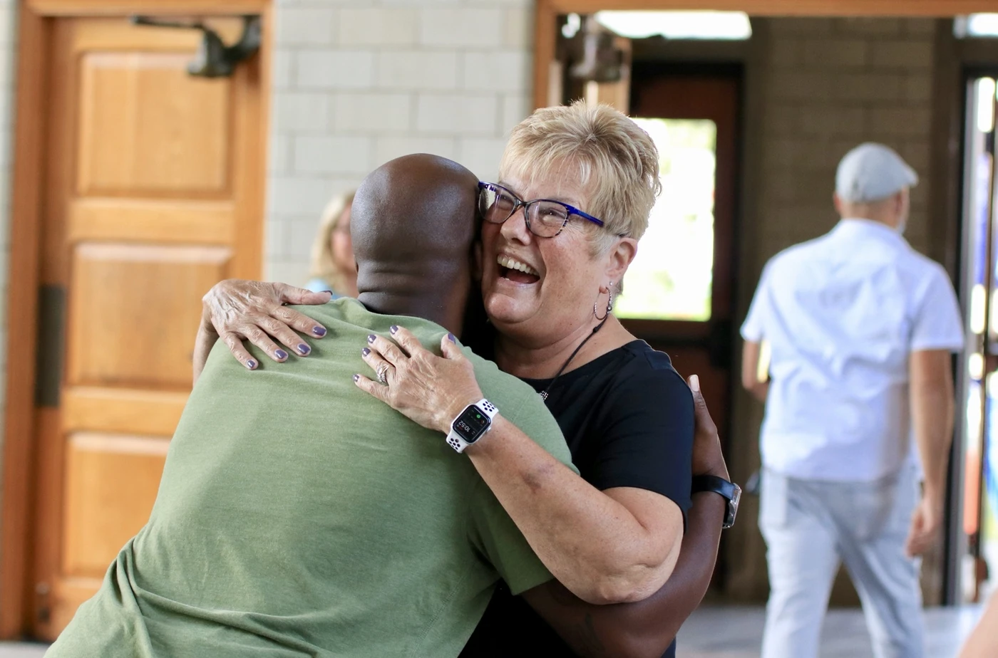 A joyful embrace during the church anniversary celebration